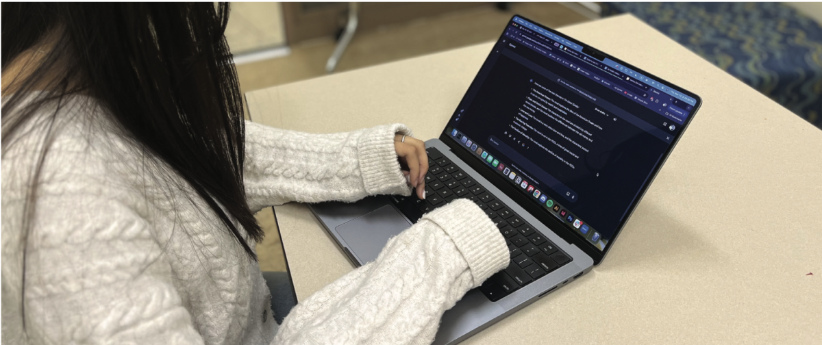 A sophomore student at Palo Alto High School utilizes Google's Gemini generative artificial intelligence chat-bot to help brainstorm an outline for her English essay.